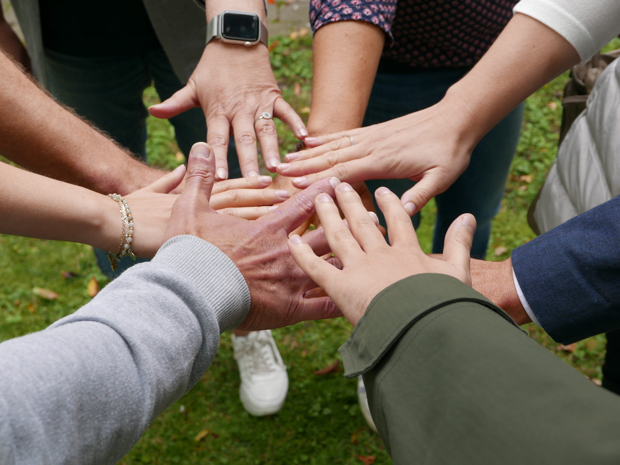 team hands holding together